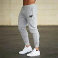 Pantalon de jogging léger New Balance pour homme – Tissu respirant et fin pour l'été, idéal pour la course et l'entraînement
