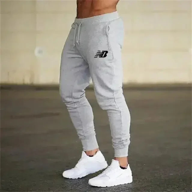 Pantalon de jogging léger New Balance pour homme – Tissu respirant et fin pour l'été, idéal pour la course et l'entraînement