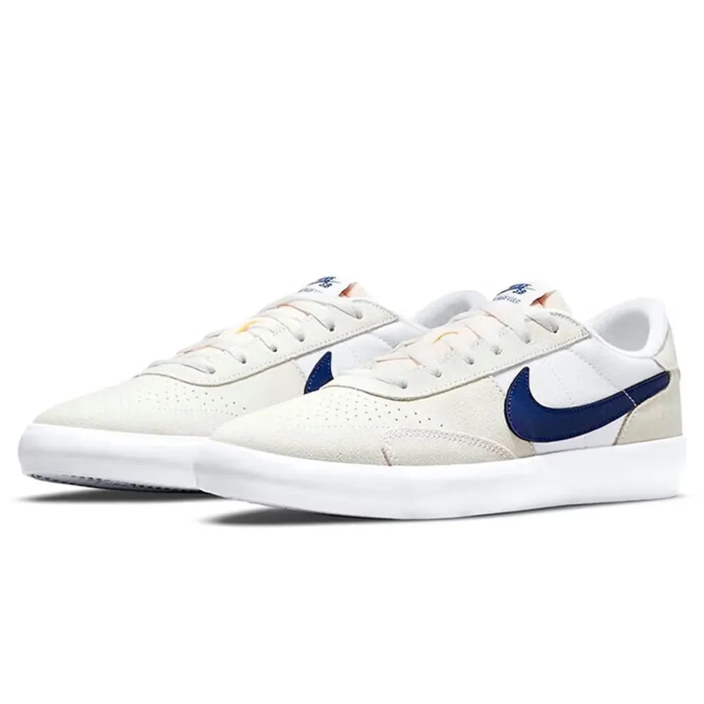 Nike Heritage Vulc SB Chaussures de skate basses confortables, antidérapantes, durables et légères Unisexe Blanc cassé et bleu CD5010-105