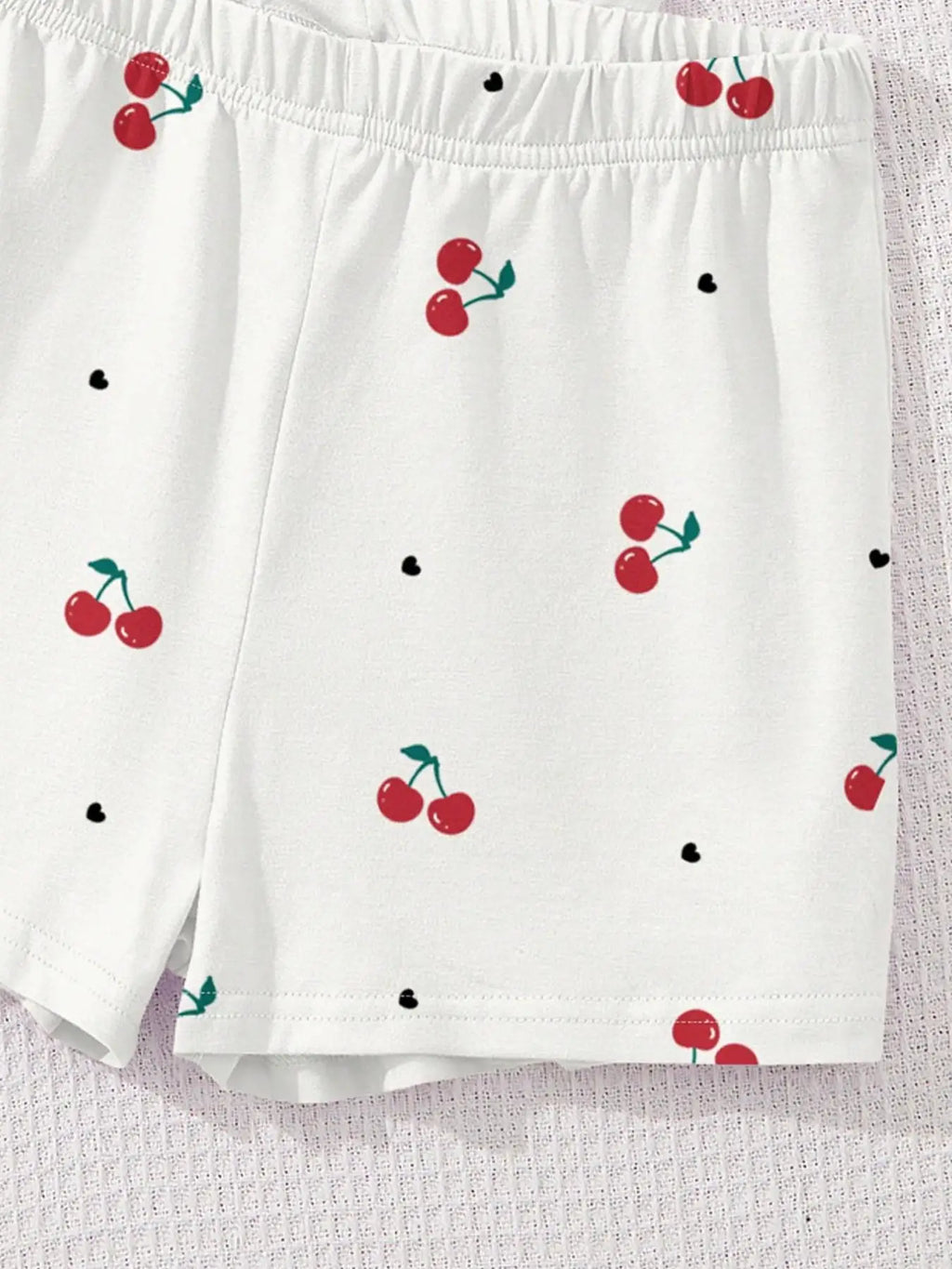 Ensemble imprimé motif cerise pour filles, haut blanc à manches courtes avec imprimé cerise + short, ensemble deux pièces, frais et tendance, adapté aux enfants de 4 à 12 ans, vêtements décontractés d'été pour la m