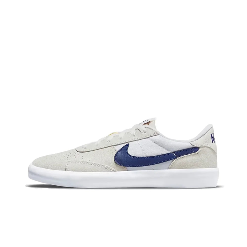 Nike Heritage Vulc SB Chaussures de skate basses confortables, antidérapantes, durables et légères Unisexe Blanc cassé et bleu CD5010-105