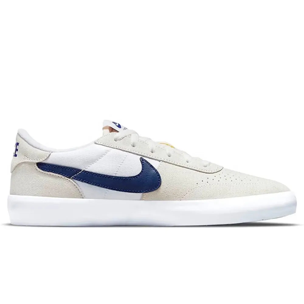 Nike Heritage Vulc SB Chaussures de skate basses confortables, antidérapantes, durables et légères Unisexe Blanc cassé et bleu CD5010-105